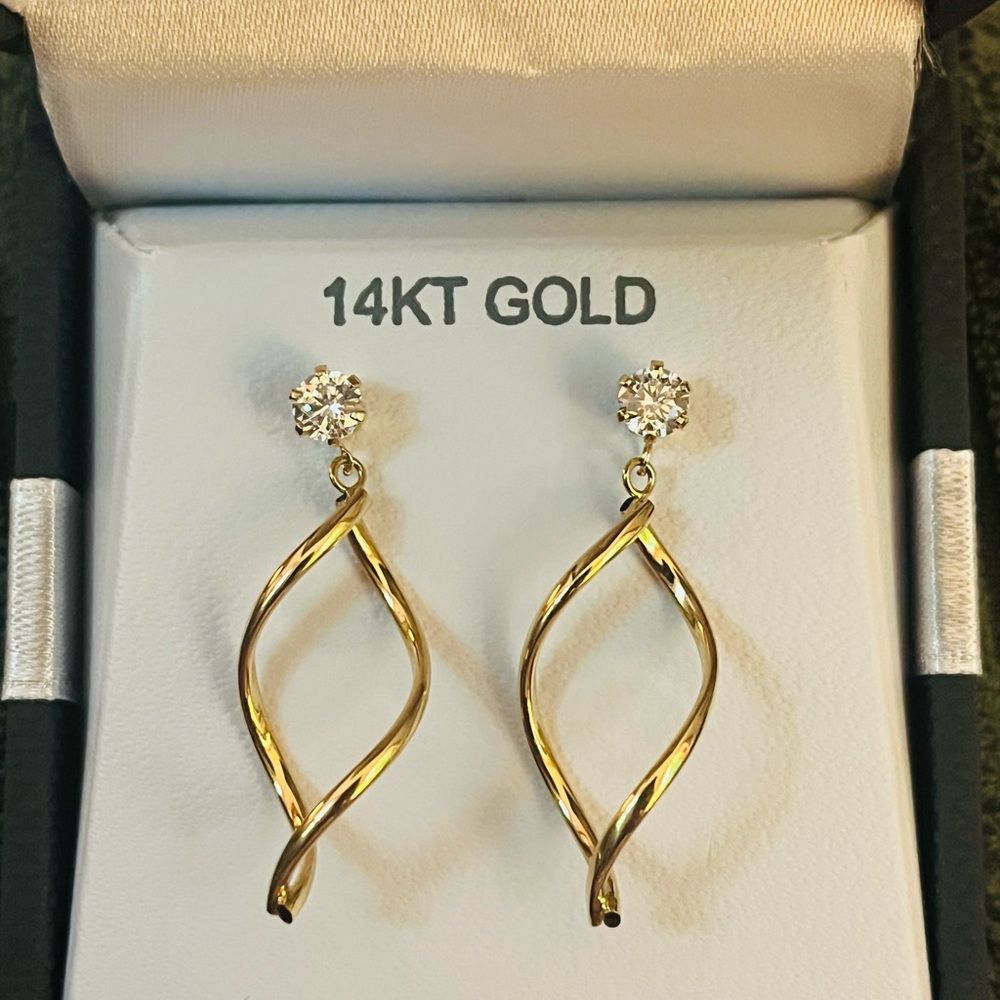 Never worn 14 carrot gold earrings with cubic zirconia stones